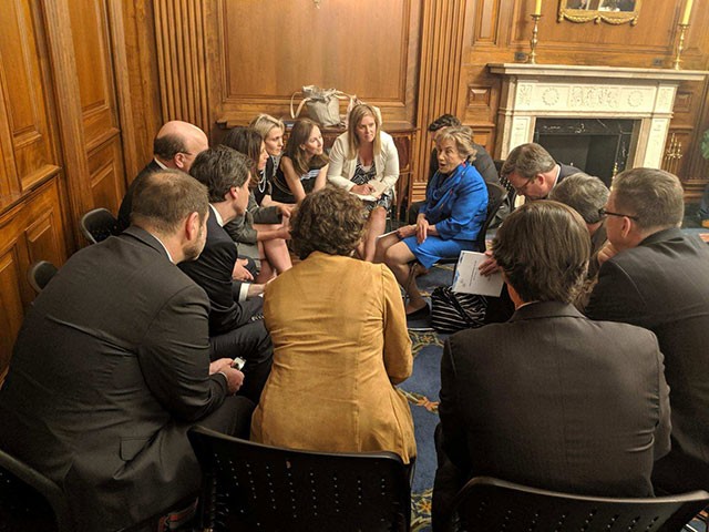 BSA President and CEO Victoria Espinel and members of BSA’s Board of Directors huddle with Chairwoman Jan Schakowsky on privacy.