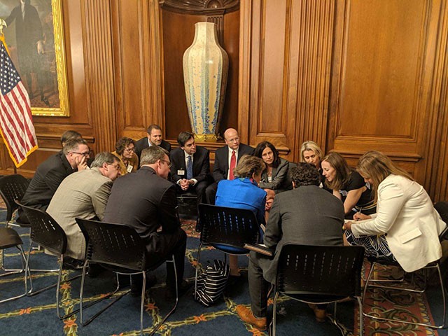 BSA President and CEO Victoria Espinel and members of BSA’s Board of Directors huddle with Chairwoman Jan Schakowsky on privacy.